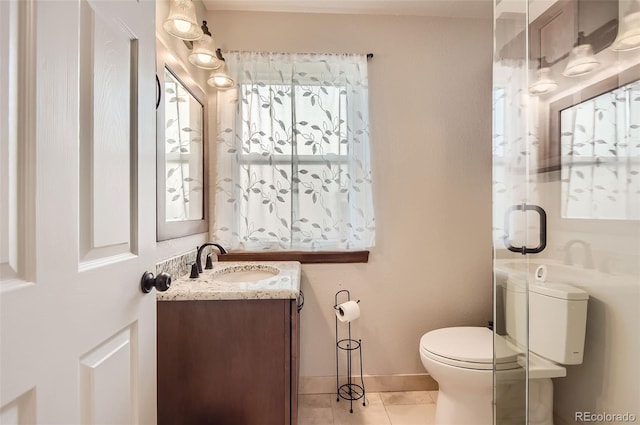 6367 Xavier St, Arvada, CO 80003 - bathroom with vanity, toilet, and tile patterned floors