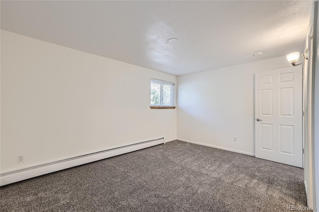 carpeted spare room with baseboards and a baseboard heating unit