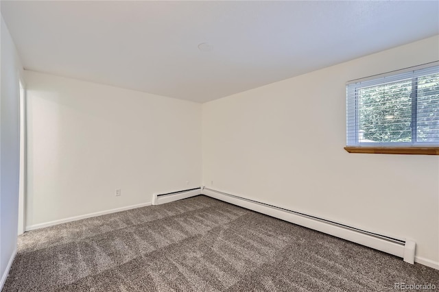 unfurnished room with a baseboard radiator, baseboards, and carpet flooring