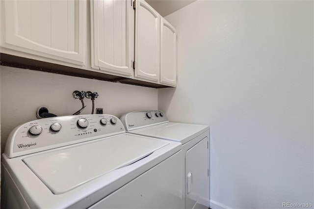 laundry area with washer and dryer and cabinet space