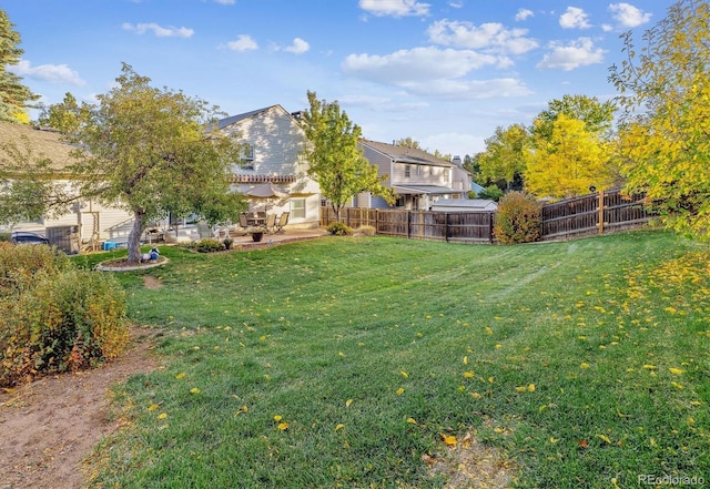 view of yard featuring a patio area and fence