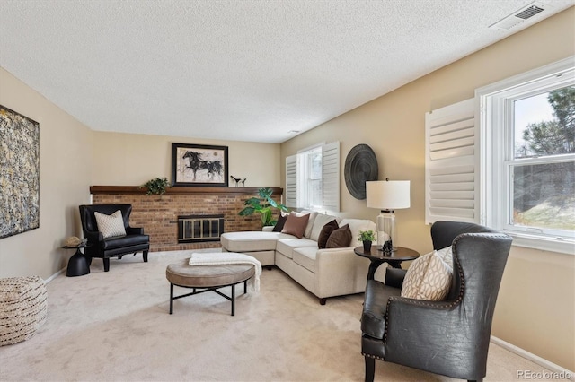 living room featuring baseboards, visible vents, a textured ceiling, a brick fireplace, and light colored carpet