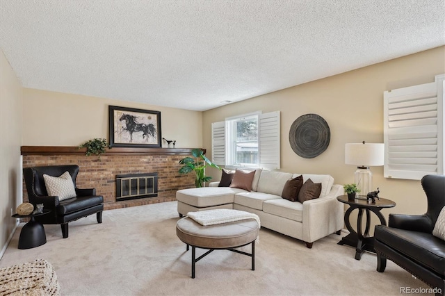 living area featuring light colored carpet, a brick fireplace, and a textured ceiling