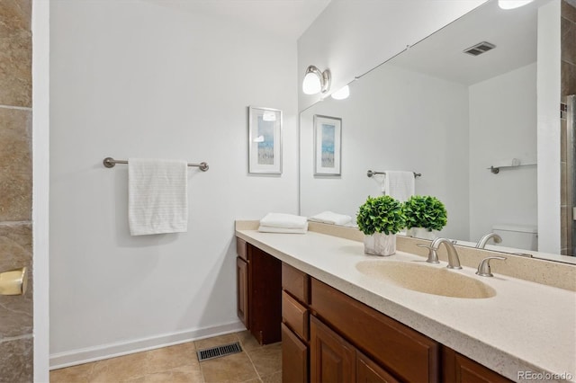 bathroom with tile patterned flooring, visible vents, toilet, and vanity