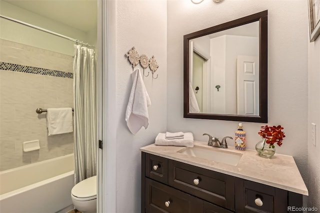 full bath featuring vanity, shower / tub combo, and toilet