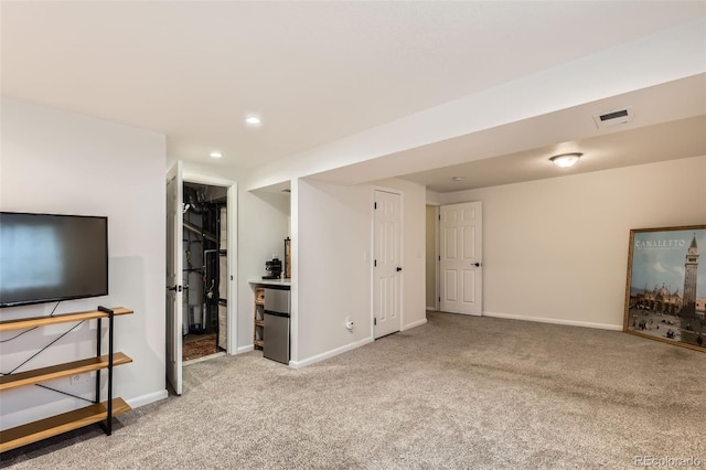 4028 Ames St, Wheat Ridge, CO 80212 - unfurnished living room with carpet floors, baseboards, and recessed lighting