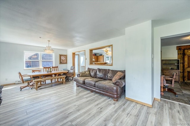 234 Carroll Ln, Breckenridge, CO 80424 - living room featuring light wood finished floors and a chandelier