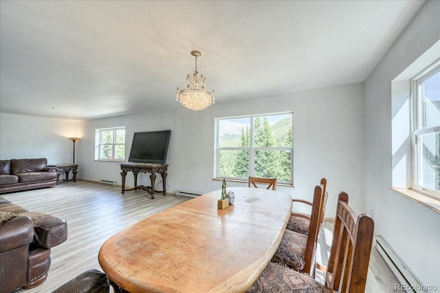 234 Carroll Ln, Breckenridge, CO 80424 - living area with a baseboard radiator, a chandelier, and wood finished floors
