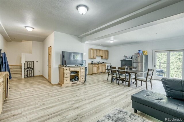 234 Carroll Ln, Breckenridge, CO 80424 - living area featuring stairs, light wood-style floors, and a textured ceiling