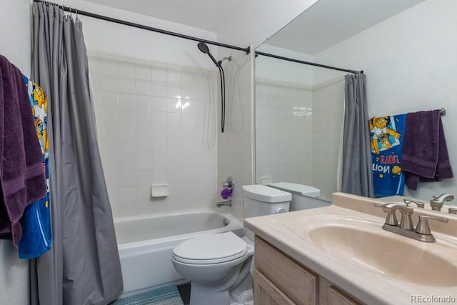 bathroom with vanity, toilet, and shower / tub combo with curtain