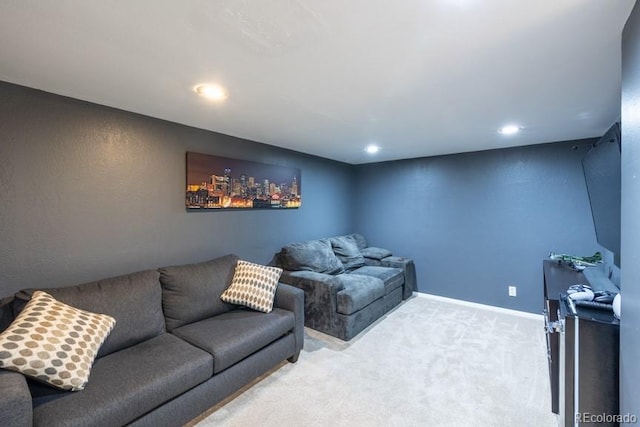 carpeted living room with recessed lighting and baseboards