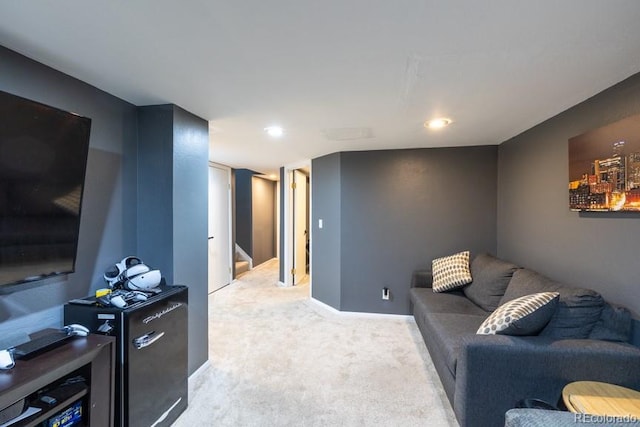 carpeted living room with baseboards and stairs