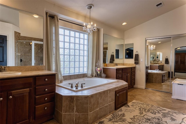 bathroom featuring vaulted ceiling, plus walk in shower, vanity, tile patterned floors, and an inviting chandelier