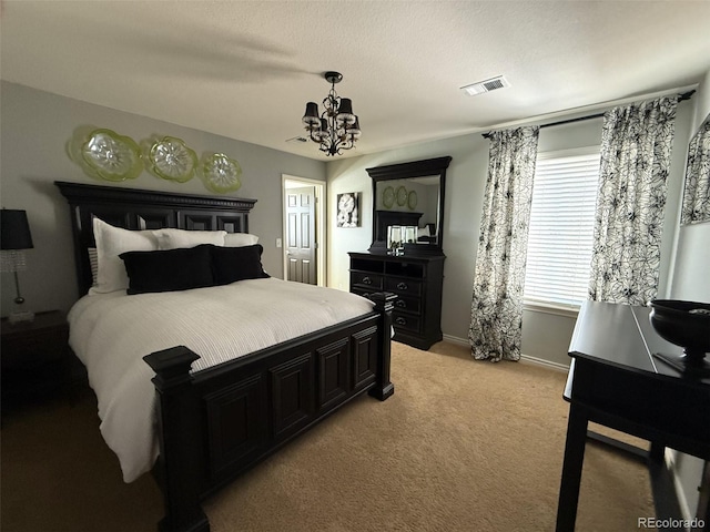 carpeted bedroom with a chandelier