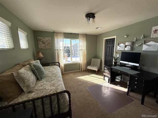 bedroom featuring light colored carpet