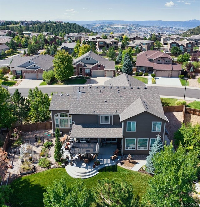 aerial view featuring a mountain view and a residential view