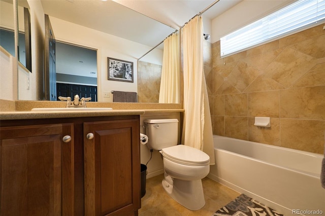 bathroom with shower / bath combination with curtain, tile patterned flooring, vanity, and toilet