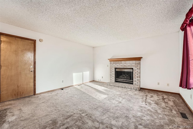 3823 S Uravan St, Aurora, CO 80013 - unfurnished living room with carpet floors, a brick fireplace, a textured ceiling, and baseboards