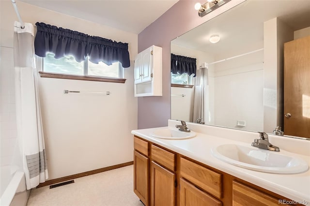 3823 S Uravan St, Aurora, CO 80013 - full bathroom featuring double vanity and shower / bath combination with curtain