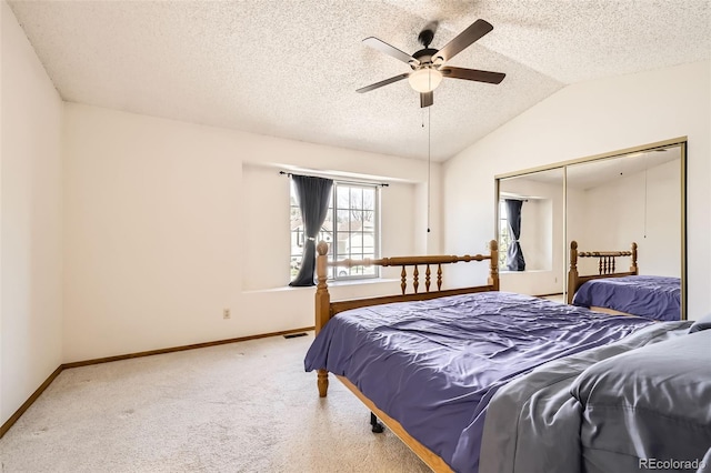 3823 S Uravan St, Aurora, CO 80013 - carpeted bedroom featuring baseboards, lofted ceiling, a textured ceiling, a closet, and a ceiling fan