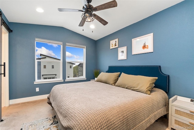 7808 W 43rd Pl, Wheat Ridge, CO 80033 - carpeted bedroom with vaulted ceiling, a barn door, baseboards, a ceiling fan, and recessed lighting
