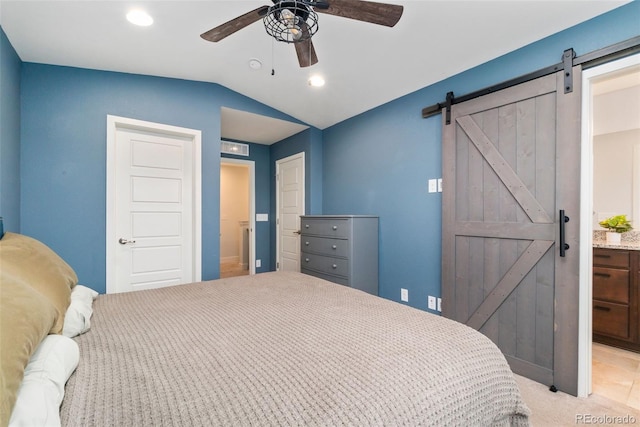 7808 W 43rd Pl, Wheat Ridge, CO 80033 - bedroom with a barn door, vaulted ceiling, recessed lighting, a ceiling fan, and light carpet