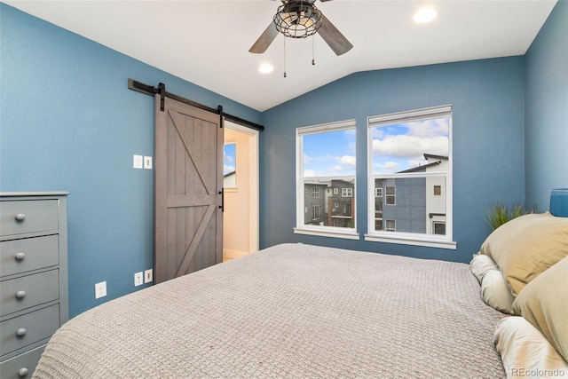 7808 W 43rd Pl, Wheat Ridge, CO 80033 - bedroom featuring vaulted ceiling, a barn door, ceiling fan, and recessed lighting