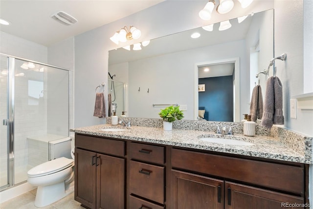 7808 W 43rd Pl, Wheat Ridge, CO 80033 - full bath featuring a stall shower, double vanity, toilet, tile patterned floors, and ensuite bathroom