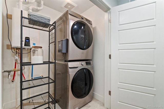 7808 W 43rd Pl, Wheat Ridge, CO 80033 - clothes washing area featuring estacked washer and dryer and baseboards