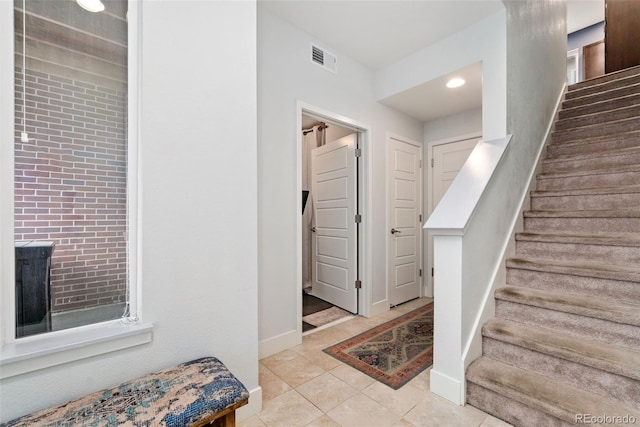 7808 W 43rd Pl, Wheat Ridge, CO 80033 - staircase featuring tile patterned flooring, baseboards, and recessed lighting