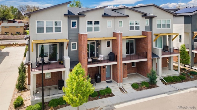 7808 W 43rd Pl, Wheat Ridge, CO 80033 - rear view of property featuring stucco siding and a balcony