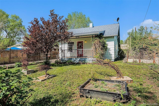 4635 Teller St, Wheat Ridge, CO 80033 - ranch-style house with a garden, covered porch, roof with shingles, and a chimney