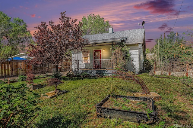 4635 Teller St, Wheat Ridge, CO 80033 - single story home featuring a vegetable garden, covered porch, and a shingled roof
