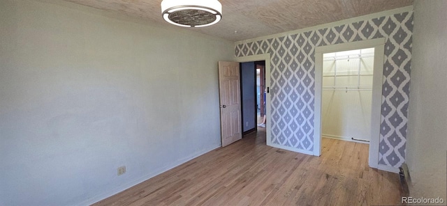 4635 Teller St, Wheat Ridge, CO 80033 - spare room featuring baseboards and wood finished floors