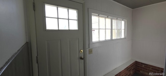 4635 Teller St, Wheat Ridge, CO 80033 - entryway featuring a wainscoted wall and plenty of natural light