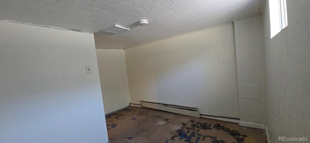 4635 Teller St, Wheat Ridge, CO 80033 - empty room featuring baseboard heating and a textured ceiling