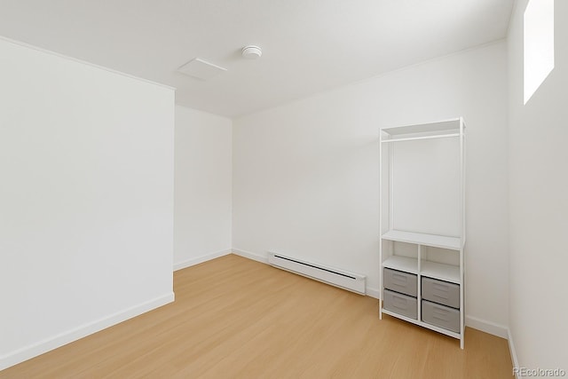 4635 Teller St, Wheat Ridge, CO 80033 - unfurnished room with baseboard heating, wood finished floors, and a smoke detector