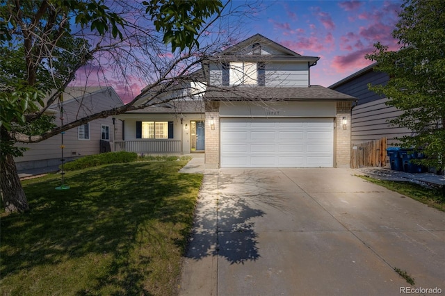 11727 Oswego St, Commerce City, CO 80640 - traditional-style house featuring brick siding, driveway, and covered porch
