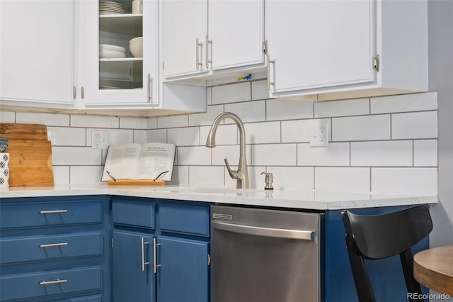 7040 E Girard Ave Unit 207, Denver, CO 80224 - kitchen featuring dishwasher, blue cabinetry, light countertops, and white cabinets