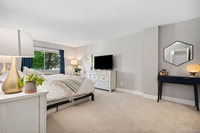 7040 E Girard Ave Unit 207, Denver, CO 80224 - bedroom with light colored carpet and baseboards