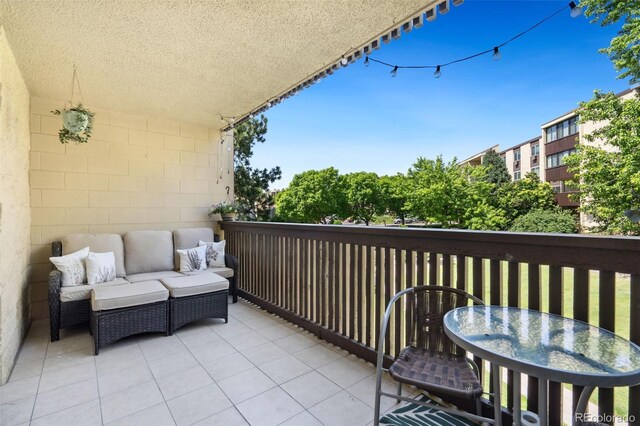 7040 E Girard Ave Unit 207, Denver, CO 80224 - balcony featuring an outdoor living space and outdoor dining area