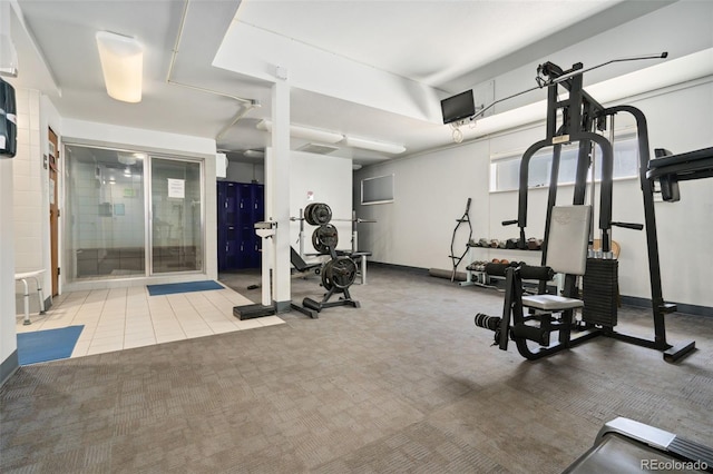 7040 E Girard Ave Unit 207, Denver, CO 80224 - exercise room with carpet flooring and baseboards