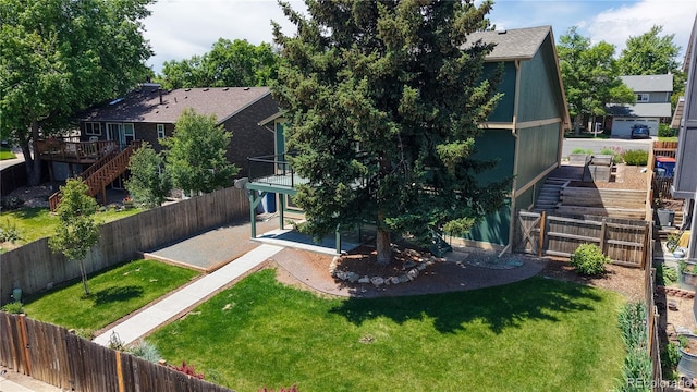 3883 S Fraser St, Aurora, CO 80014 - back of house featuring stairs, a patio area, a fenced backyard, and a deck