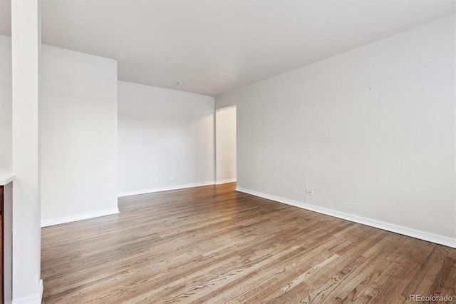 spare room featuring light hardwood / wood-style floors