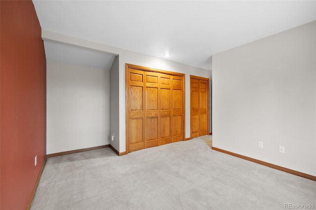 unfurnished bedroom with light carpet