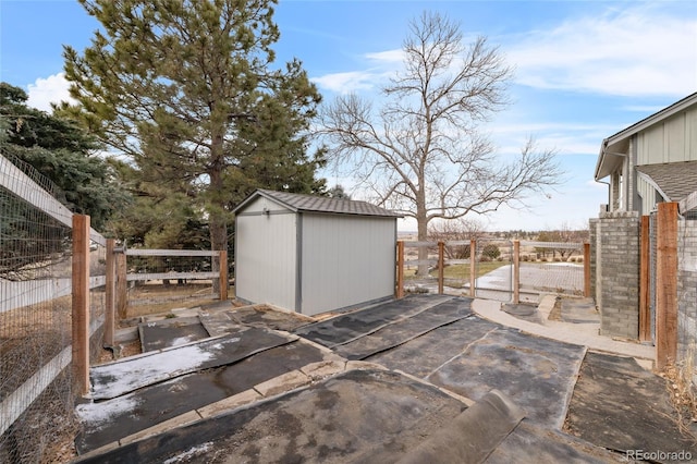 view of patio / terrace featuring a storage unit