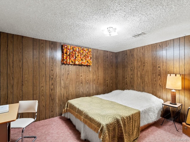 3018 S Depew St, Denver, CO 80227 - bedroom featuring carpet flooring, wooden walls, and a textured ceiling