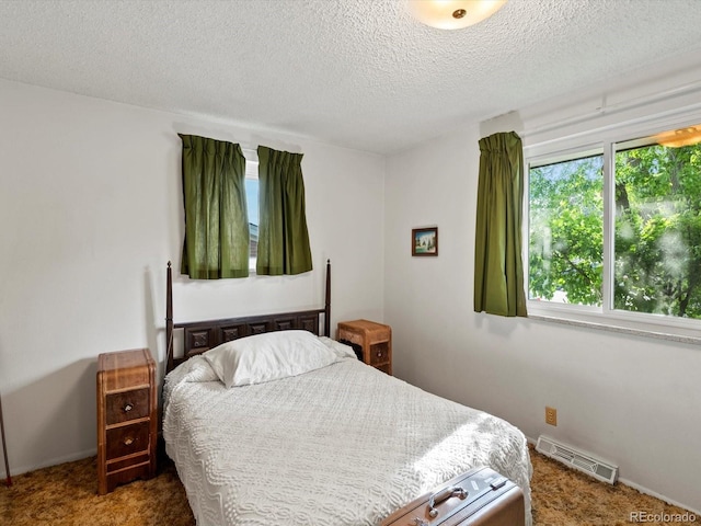 3018 S Depew St, Denver, CO 80227 - carpeted bedroom with a textured ceiling and baseboards