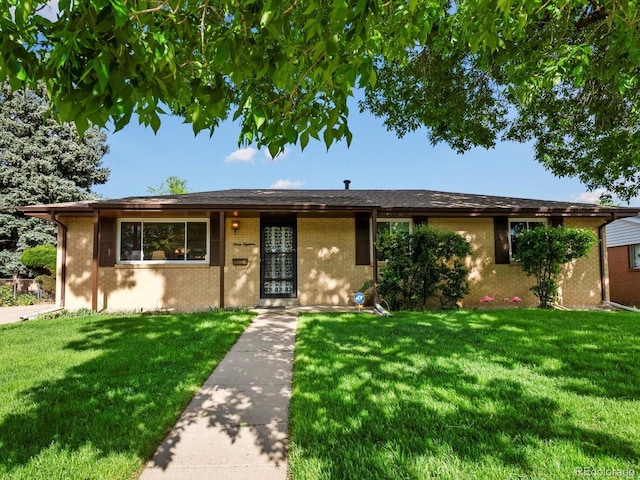 3018 S Depew St, Denver, CO 80227 - ranch-style house featuring brick siding and a front yard