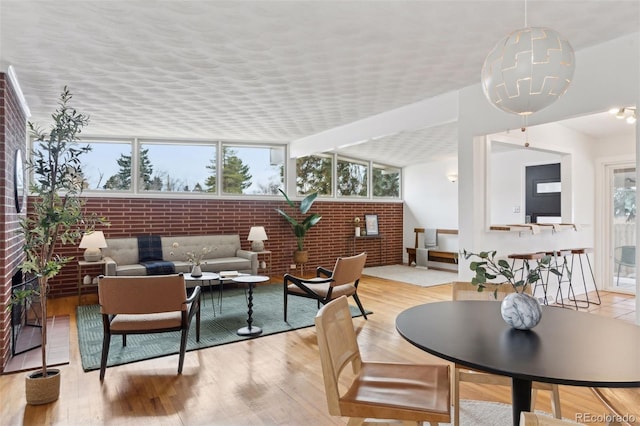 sunroom with a healthy amount of sunlight and a chandelier